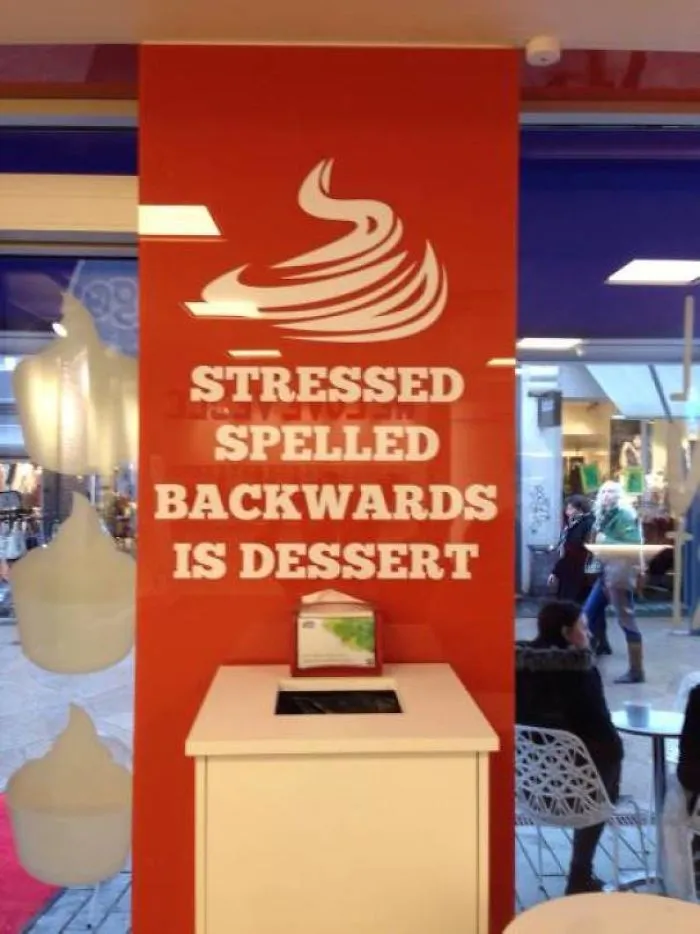 Sign displaying "Stressed spelled backwards is dessert" in a shop, illustrating one of the funniest design fails.