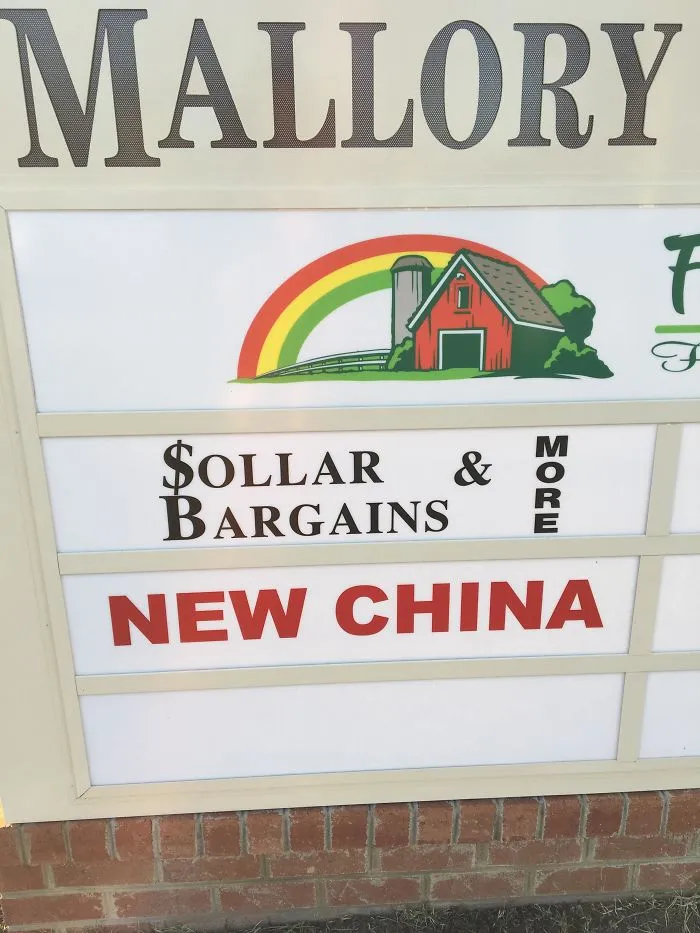 Sign with funny design fail: "Sollar Bargains" instead of "Dollar Bargains" and "New China" in red.