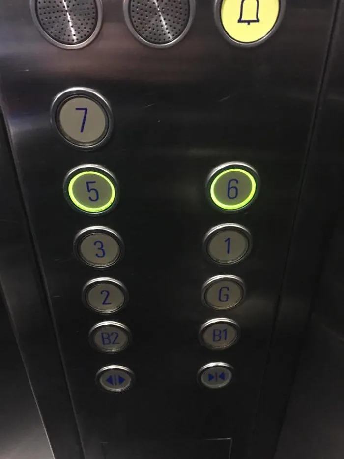 Elevator panel design fail with mismatched button numbers.