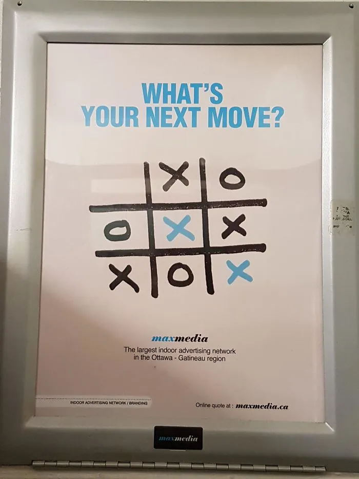 Tic-tac-toe board with a humorous design fail, showing a misaligned game grid and the text "What's Your Next Move?".