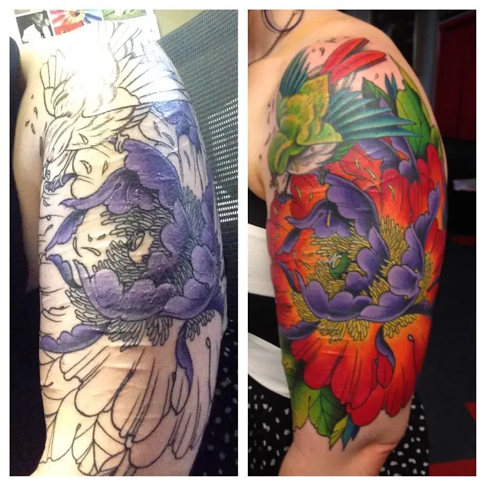 Tattoo transforms scar into vibrant floral artwork with colors of purple, red, and green.