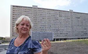 Portraits Of Tenants Holding Replicas Of Their Concrete Homes Awaiting Demolition
