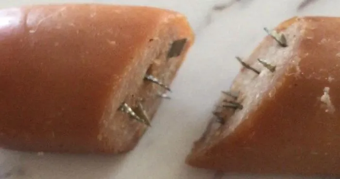Dog Owner Shocked After Finding Hot Dogs Stuffed With Razor Blades In Her Yard