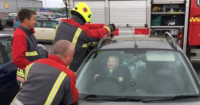 Toddler Can't Stop Laughing After Locking Himself In Car While 5 Firefighters Try To Rescue Him
