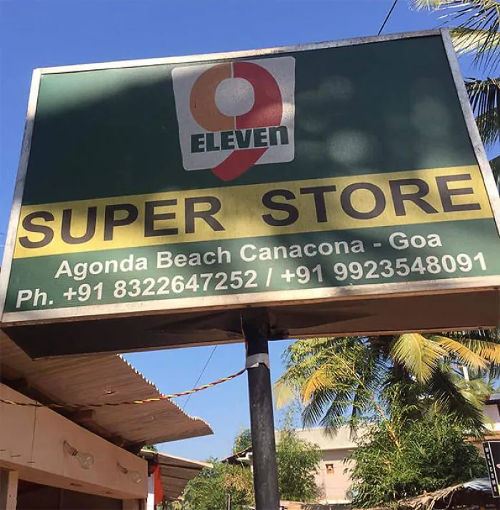 Store sign design fail: "9 Eleven Super Store" in Goa, featuring mismatched branding elements.