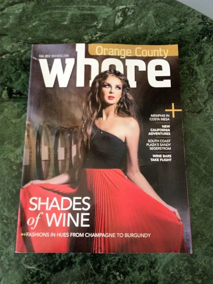 Magazine cover with amusing design fail, featuring a model in a red dress and bold title text saying "where".