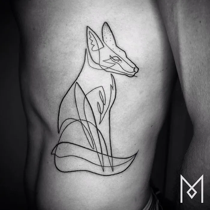 Continuous line tattoo of a fox on skin, created by Mo Ganji, showcasing minimalistic design.