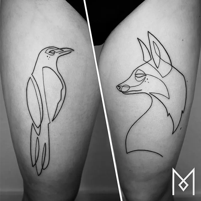 Two single-line tattoos by Mo Ganji: a penguin and a fox on separate legs.