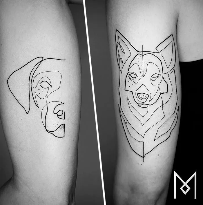 Single continuous line tattoos of a dog and wolf by Mo Ganji on skin.