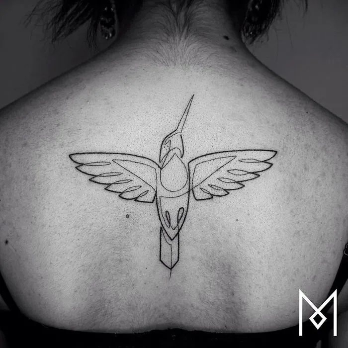 Single line tattoo of a bird on a back, created by Mo Ganji.