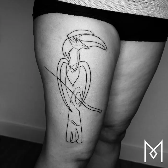 Single continuous line tattoo of a bird on a leg by Mo Ganji.