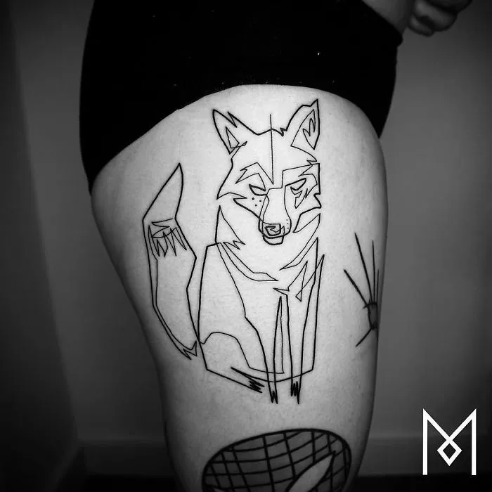 Single line tattoo of a wolf on a person's thigh by Mo Ganji.