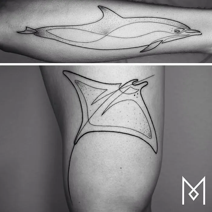 Single line tattoos of a dolphin and a manta ray by artist Mo Ganji.