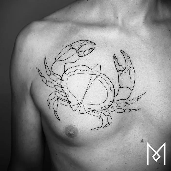 Single continuous line crab tattoo on a person's chest, created by Mo Ganji.