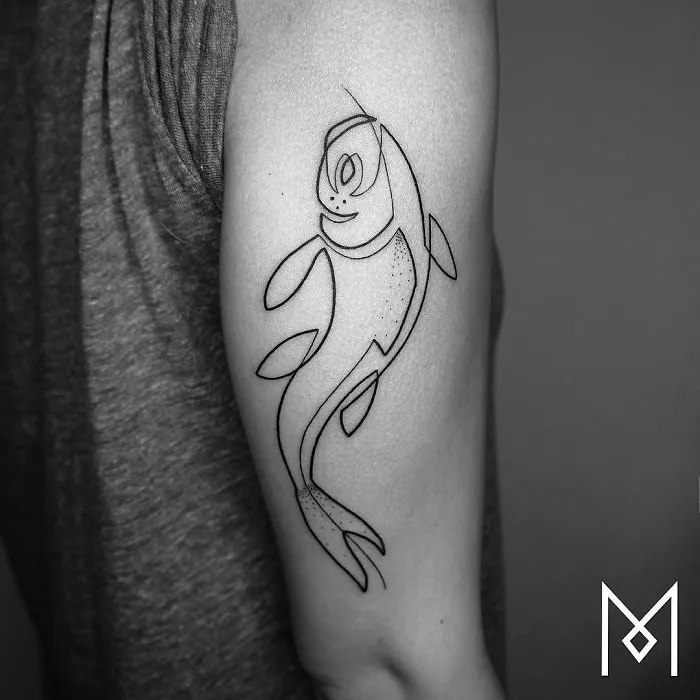 Single continuous line tattoo of a fish on an arm, designed by Mo Ganji.