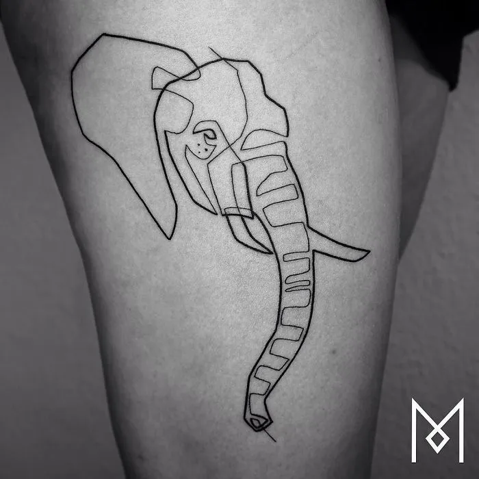 Single line elephant tattoo by Mo Ganji on a person's skin.
