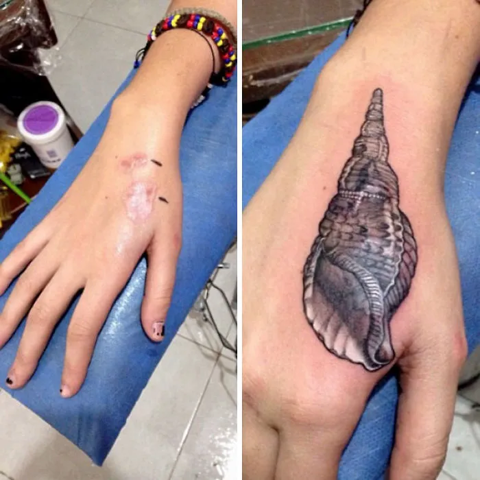 A scar covered by an artistic seashell tattoo on a hand, transforming it into a work of art.