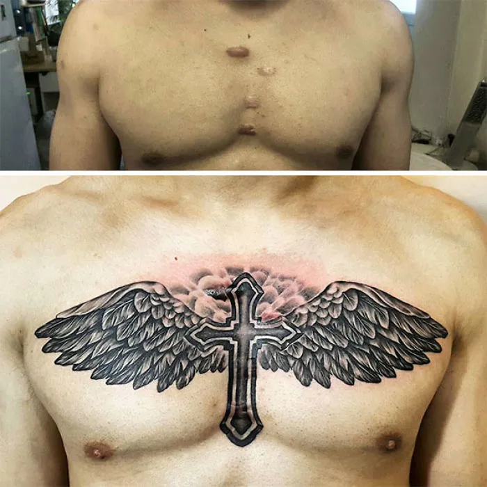 Tattoo design of a cross with wings transforming chest scars into art.