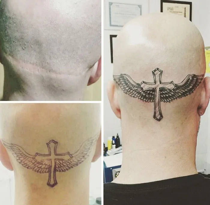 Tattoo covers scar with a winged cross design, transforming it into art.