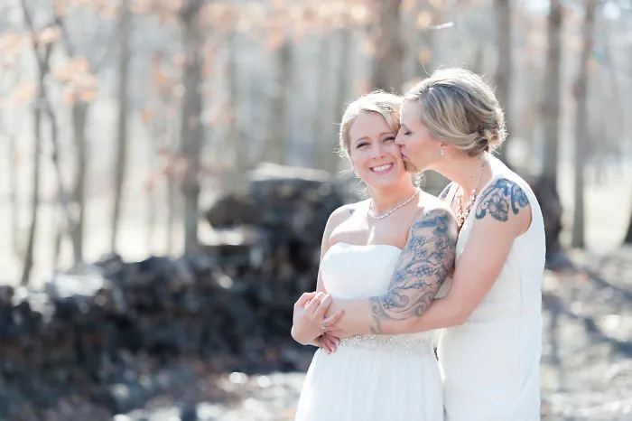 Two women hugging and kissing 