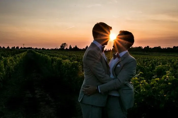 Two man hugging at sunset 