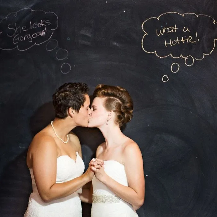 Two women kissing 