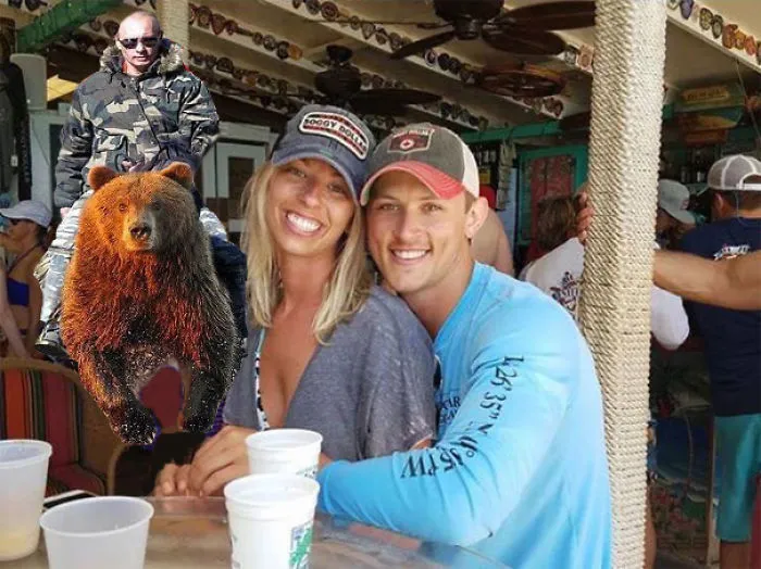 Couple Asks Internet To Photoshop Out Shirtless Guy From Engagement Photo, Regrets It Immediately