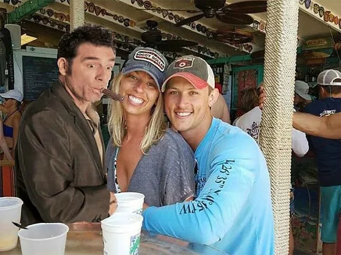 Couple Asks Internet To Photoshop Out Shirtless Guy From Engagement Photo, Regrets It Immediately