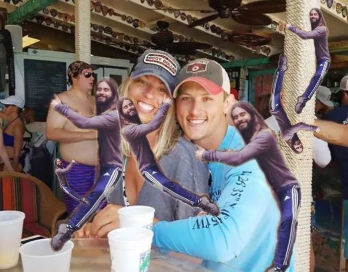 Couple Asks Internet To Photoshop Out Shirtless Guy From Engagement Photo, Regrets It Immediately