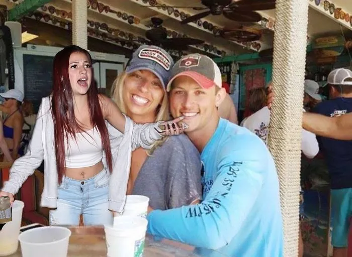 Couple Asks Internet To Photoshop Out Shirtless Guy From Engagement Photo, Regrets It Immediately