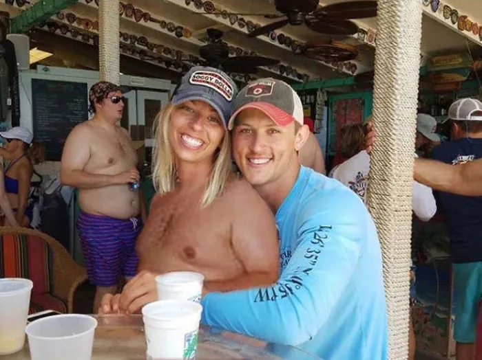 Couple Asks Internet To Photoshop Out Shirtless Guy From Engagement Photo, Regrets It Immediately