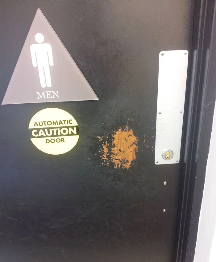 Door Worn Down By People Pushing Against It