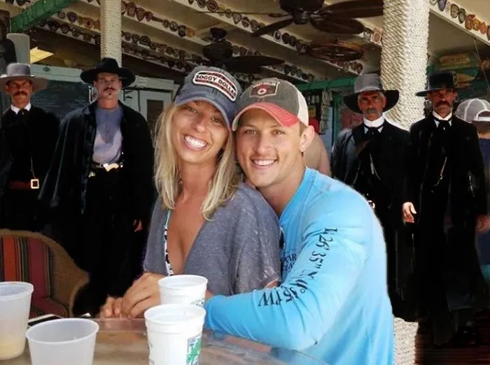 Couple Asks Internet To Photoshop Out Shirtless Guy From Engagement Photo, Regrets It Immediately