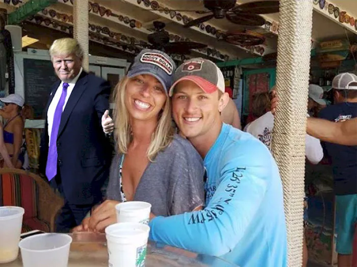 Couple Asks Internet To Photoshop Out Shirtless Guy From Engagement Photo, Regrets It Immediately