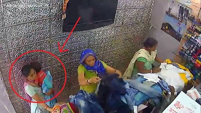 Lady Stealing Clothes Caught On Cam