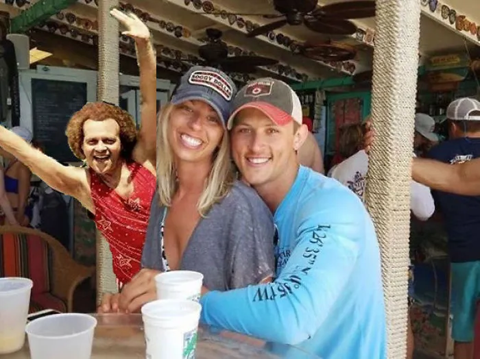 Couple Asks Internet To Photoshop Out Shirtless Guy From Engagement Photo, Regrets It Immediately