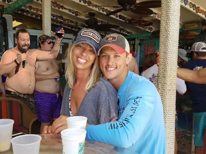 Couple Asks Internet To Photoshop Out Shirtless Guy From Engagement Photo, Regrets It Immediately
