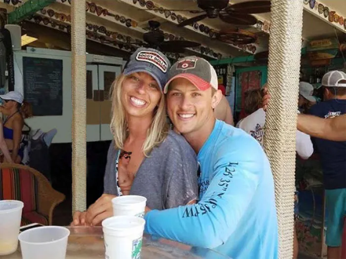 Couple Asks Internet To Photoshop Out Shirtless Guy From Engagement Photo, Regrets It Immediately