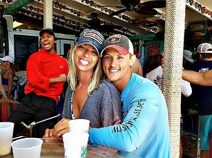 Couple Asks Internet To Photoshop Out Shirtless Guy From Engagement Photo, Regrets It Immediately