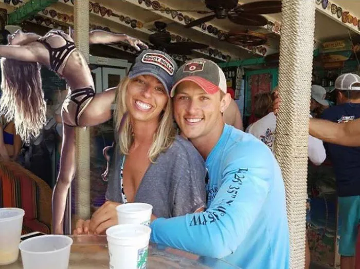 Couple Asks Internet To Photoshop Out Shirtless Guy From Engagement Photo, Regrets It Immediately