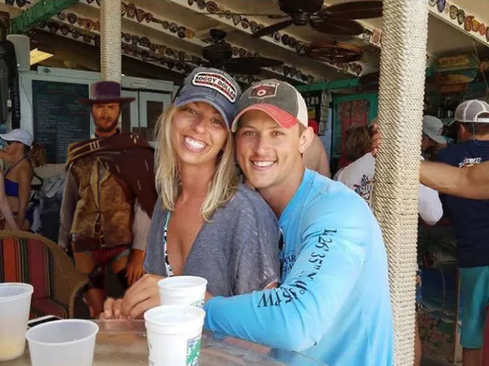 Couple Asks Internet To Photoshop Out Shirtless Guy From Engagement Photo, Regrets It Immediately