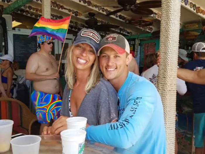 Couple Asks Internet To Photoshop Out Shirtless Guy From Engagement Photo, Regrets It Immediately