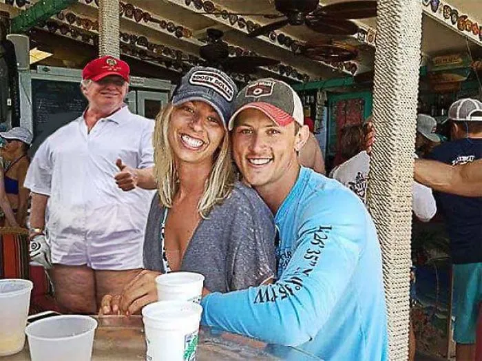 Couple Asks Internet To Photoshop Out Shirtless Guy From Engagement Photo, Regrets It Immediately