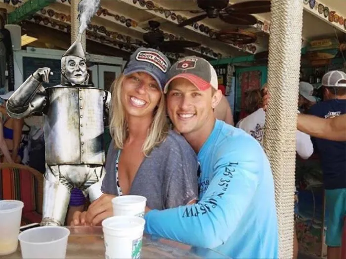 Couple Asks Internet To Photoshop Out Shirtless Guy From Engagement Photo, Regrets It Immediately