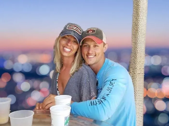 Couple Asks Internet To Photoshop Out Shirtless Guy From Engagement Photo, Regrets It Immediately