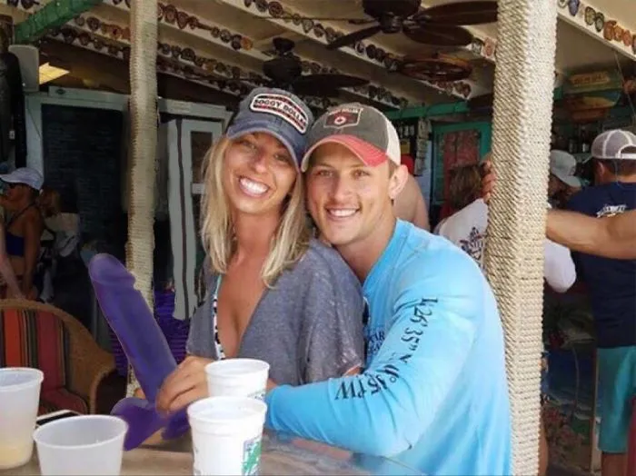 Couple Asks Internet To Photoshop Out Shirtless Guy From Engagement Photo, Regrets It Immediately