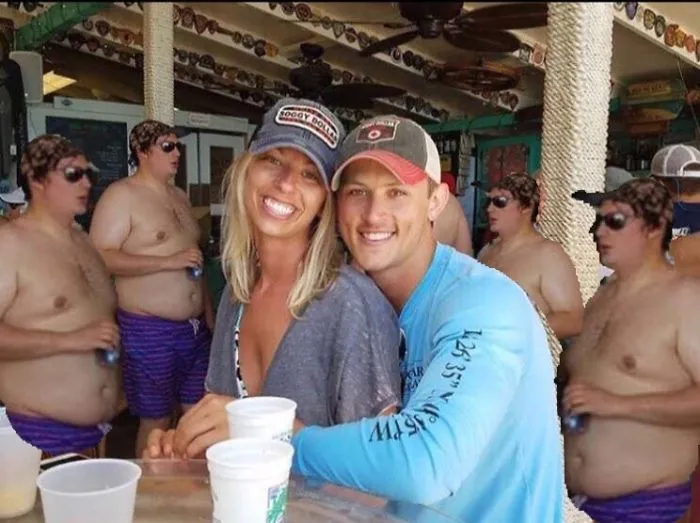 Couple Asks Internet To Photoshop Out Shirtless Guy From Engagement Photo, Regrets It Immediately
