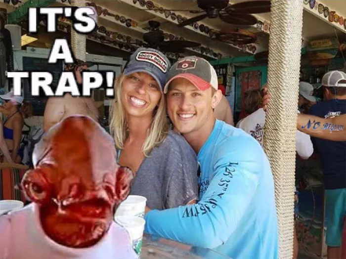 Couple Asks Internet To Photoshop Out Shirtless Guy From Engagement Photo, Regrets It Immediately
