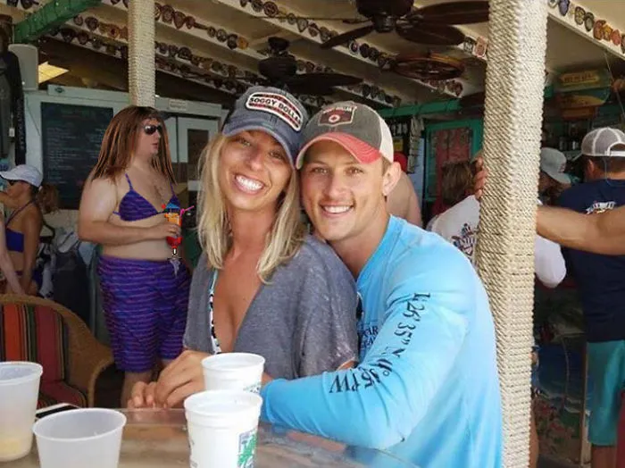 Couple Asks Internet To Photoshop Out Shirtless Guy From Engagement Photo, Regrets It Immediately
