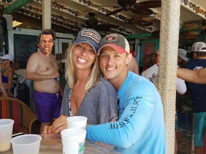 Couple Asks Internet To Photoshop Out Shirtless Guy From Engagement Photo, Regrets It Immediately